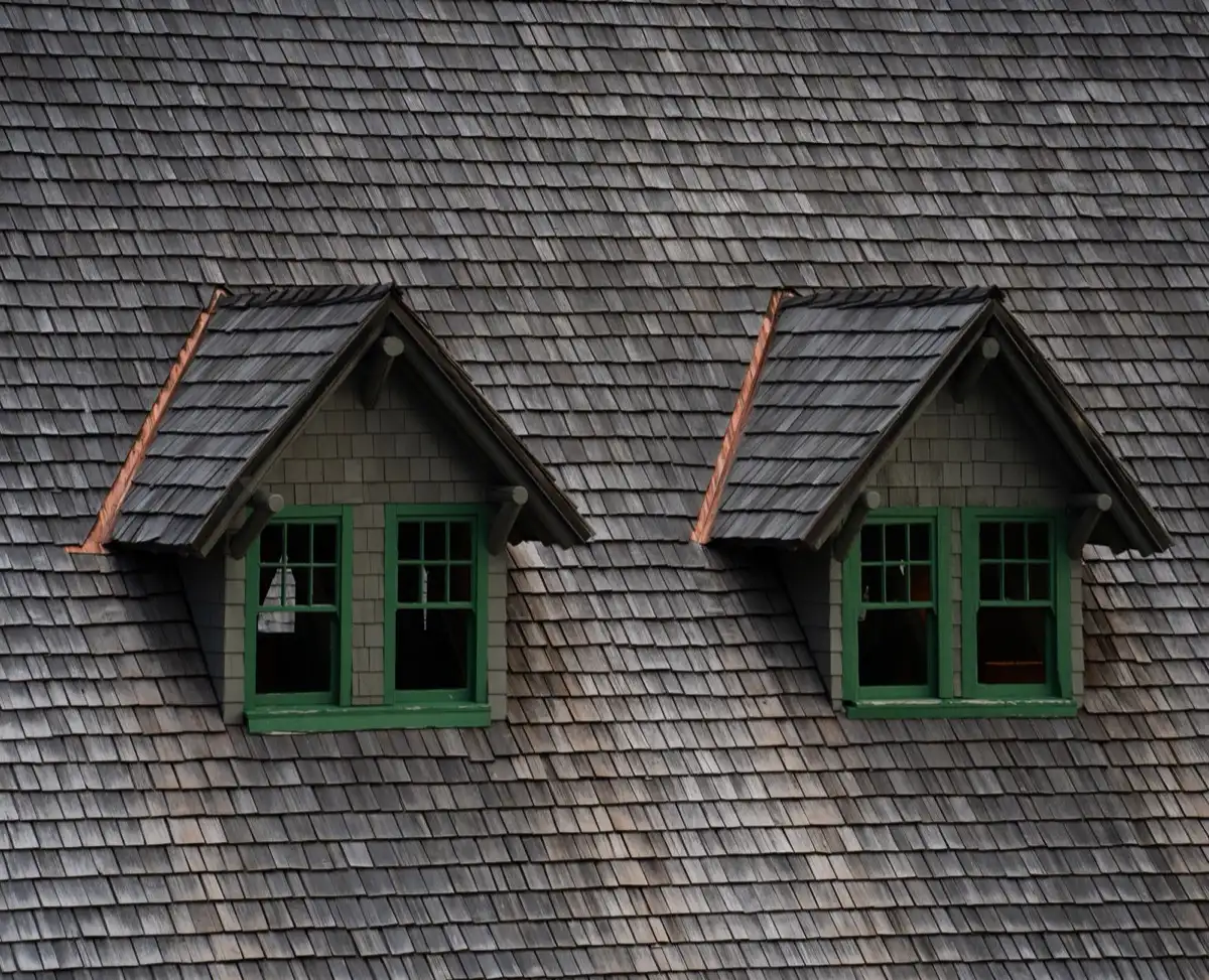Dormers on a shingle roof in Wilson, NC, where step flashing and kickout flashing carry water past the walls