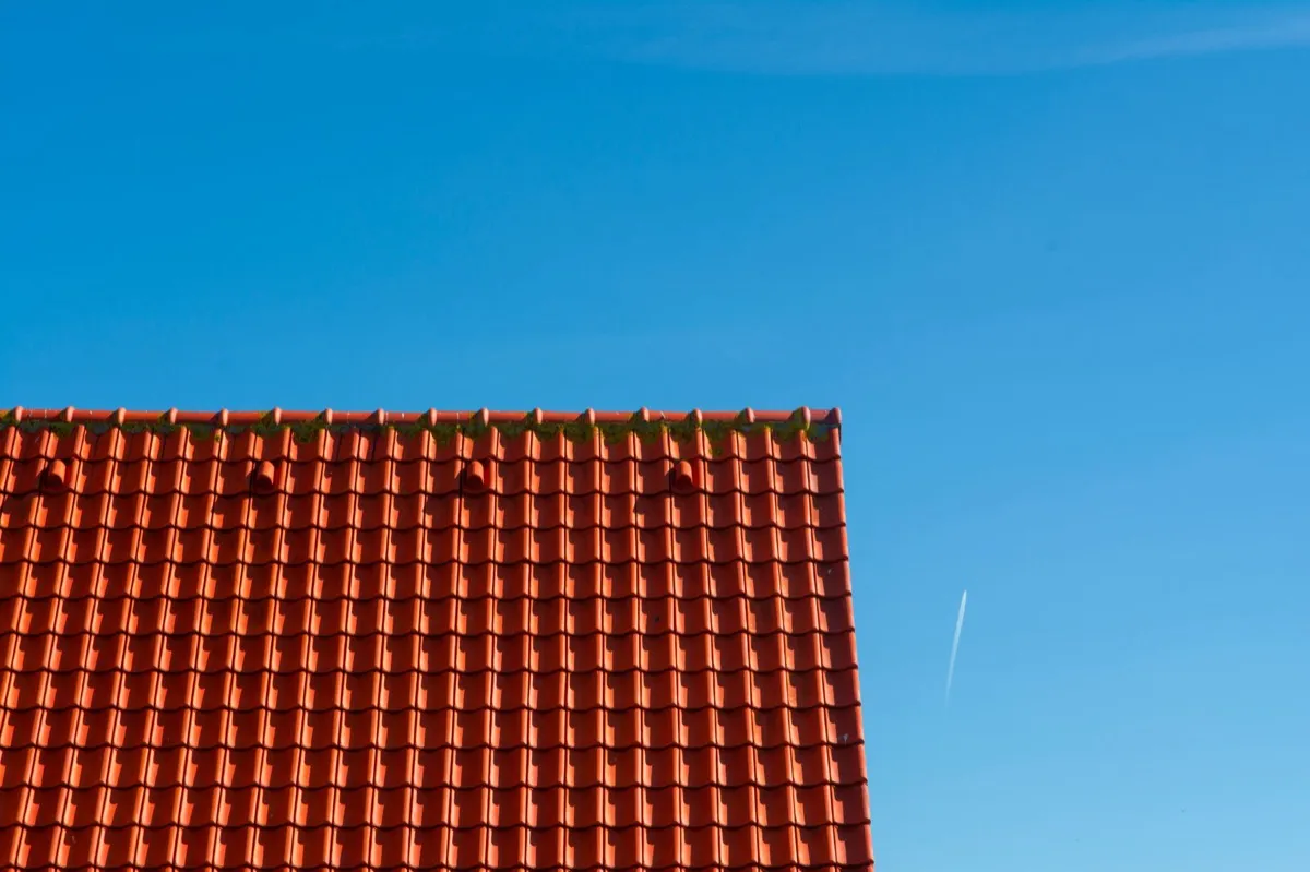 Tile roof gable in full sun, the kind of exposure that sets roof life in Wilson, NC